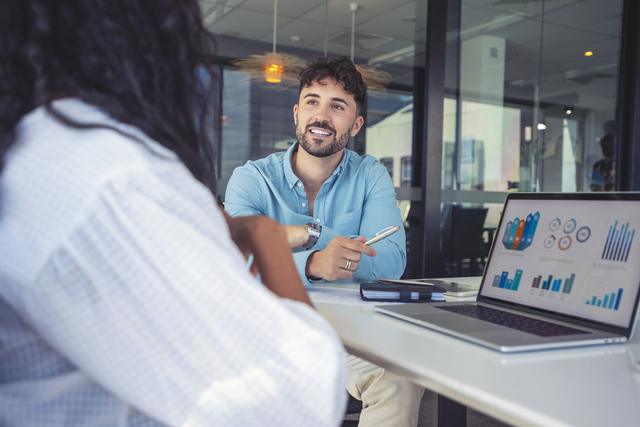 An advisor reviewing financial charts with a client